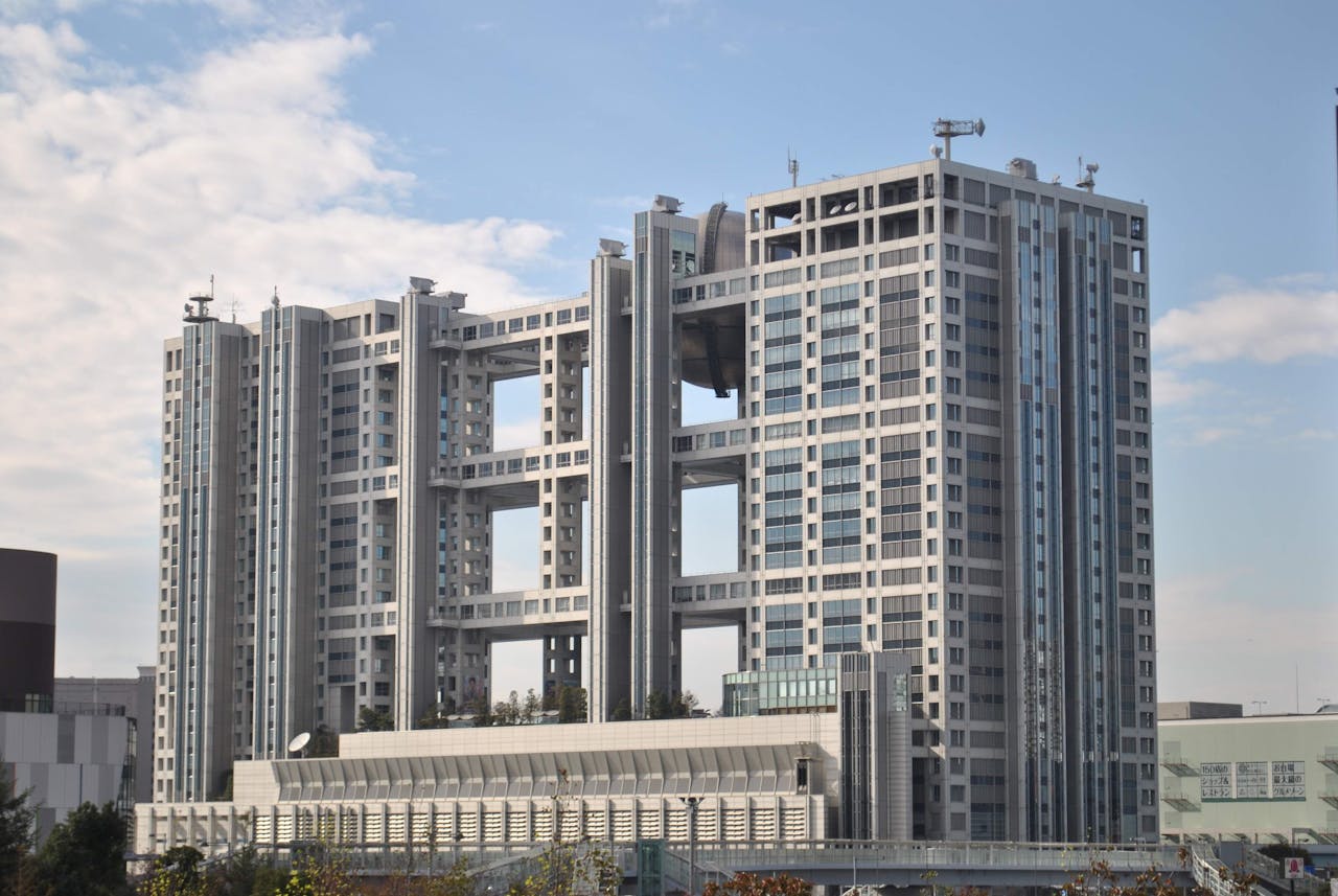 Modern architectural design of iconic building with clear sky backdrop.